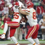 Kansas City Chiefs running back Jamaal Charles (25) celebrates his touchdown with teammate Anthony Fasano (80) during the first half of an NFL football game against the Arizona Cardinals, Sunday, Dec. 7, 2014, in Glendale, Ariz. (AP Photo/Ross D. Franklin)