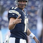 San Diego Chargers quarterback Philip Rivers gestures during warmup before facing the Arizona Cardinals in an NFL preseason football game Thursday, Aug. 28, 2014, in San Diego. (AP Photo/Denis Poroy)