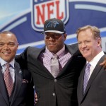 Missouri defensive end Kony Ealy poses for photos with NFL commissioner Roger Goodell and Mark Carrier after being selected as the 60th pick by the Carolina Panthers in the second round of the 2014 NFL Draft, Friday, May 9, 2014, in New York. (AP Photo/Jason DeCrow)