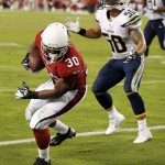 Arizona Cardinals running back Stepfan Taylor (30) pulls in a touchdown pass as San Diego Chargers inside linebacker Manti Te'o (50) stands near during the second half of an NFL football game, Monday, Sept. 8, 2014, in Glendale, Ariz. (AP Photo/Ross D. Franklin)