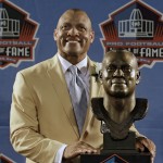 Hall of Fame inductee Aeneas Williams poses with his bust during the 2014 Pro Football Hall of Fame Enshrinement Ceremony at the Pro Football Hall of Fame Saturday, Aug. 2, 2014, in Canton, Ohio. (AP Photo/Tony Dejak)