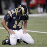 St. Louis Rams quarterback Shaun Hill (14) kneels on the turf during the second half of an NFL football game against the Arizona Cardinals Thursday, Dec. 11, 2014 in St. Louis. (AP Photo/Tom Gannam)
