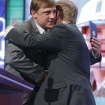 
Former New York Jets quarterback Chad Pennington greets NFL commissioner Roger Goodell before announcing the Jets' second round pick during the 2014 NFL Draft, Friday, May 9, 2014, in New York. (AP Photo/Jason DeCrow)