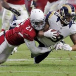 St. Louis Rams wide receiver Chris Givens (13) is hit by Arizona Cardinals cornerback Patrick Peterson (21) during the second half of an NFL football game, Sunday, Nov. 9, 2014, in Glendale, Ariz. (AP Photo/Rick Scuteri)