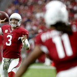 Arizona Cardinals quarterback Carson Palmer (3) throws to Larry Fitzgerald (11) during the first half of an NFL football game against the St. Louis Rams, Sunday, Nov. 9, 2014, in Glendale, Ariz. (AP Photo/Ross D. Franklin)
