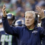 Seattle Seahawks head coach Pete Carroll motions to his team against the Arizona Cardinals in the first half of an NFL football game, Sunday, Nov. 23, 2014, in Seattle. (AP Photo/Elaine Thompson)