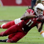 Arizona Cardinals wide receiver Larry Fitzgerald (11) makes a catch against the Kansas City Chiefs during the first half of an NFL football game, Sunday, Dec. 7, 2014, in Glendale, Ariz. (AP Photo/Rick Scuteri)