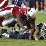 Arizona Cardinals defensive end Kareem Martin (96) sacks St. Louis Rams quarterback Austin Davis to cause a fumble for a touchdown during the second half of an NFL football game, Sunday, Nov. 9, 2014, in Glendale, Ariz. (AP Photo/Ross D. Franklin)