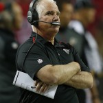 Atlanta Falcons head coach Mike Smith watches play against the Arizona Cardinals during the first half of an NFL football game, Sunday, Nov. 30, 2014, in Atlanta. (AP Photo/John Bazemore)