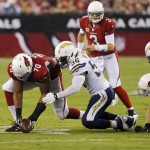 Arizona Cardinals tackle Bobby Massie (70) and San Diego Chargers inside linebacker Donald Butler (56) battle for the fumbled football during the first half of an NFL football game, Monday, Sept. 8, 2014, in Glendale, Ariz. The Chargers recovered on the play after a challenge on the field. (AP Photo/Rick Scuteri)