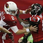 Atlanta Falcons wide receiver Devin Hester (17) works against Arizona Cardinals punter Drew Butler (2) during the first half of an NFL football game, Sunday, Nov. 30, 2014, in Atlanta. (AP Photo/Brynn Anderson)