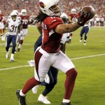 Arizona Cardinals wide receiver Larry Fitzgerald (11) can't makes the catch in the end zone against the San Diego Chargers during the second half of an NFL football game, Monday, Sept. 8, 2014, in Glendale, Ariz. (AP Photo/Ross D. Franklin)