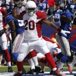 Arizona Cardinals running back Jonathan Dwyer (20) celebrates after scoring a touchdown during the first half of an NFL football game against the New York Giants on Sunday, Sept. 14, 2014, in East Rutherford, N.J. (AP Photo/Kathy Willens)