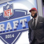Virginia tackle Morgan Moses poses for photos after being selected as the 66th pick by the Washington Redskins during the third round of the 2014 NFL Draft, Friday, May 9, 2014, in New York. (AP Photo/Jason DeCrow)