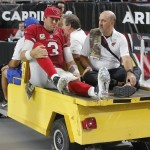 Arizona Cardinals quarterback Carson Palmer (3) leaves the NFL football game against the St. Louis Rams after an injury during the second half, Sunday, Nov. 9, 2014, in Glendale, Ariz. (AP Photo/Rick Scuteri)