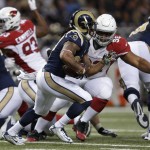 St. Louis Rams running back Tre Mason (27) runs during the first half of an NFL football game against the Arizona Cardinals Thursday, Dec. 11, 2014 in St. Louis. (AP Photo/Jeff Roberson)