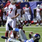 Arizona Cardinals kicker Chandler Catanzaro (7) and New York Giants' Dominique Rodgers-Cromartie (21) watch the ball after Catanzaro kicks a field goal during the first half of an NFL football game Sunday, Sept. 14, 2014, in East Rutherford, N.J. (AP Photo/Bill Kostroun)