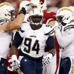San Diego Chargers defensive end Corey Liuget (94) celebrates his sack against the Arizona Cardinals during the first half of an NFL football game, Monday, Sept. 8, 2014, in Glendale, Ariz. (AP Photo/Ross D. Franklin)