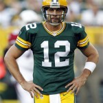 Green Bay Packers quarterback Aaron Rodgers reacts during the first half of a preseason NFL football game against the Arizona Cardinals Friday, Aug. 9, 2013, in Green Bay, Wis. (AP Photo/Mike Roemer)