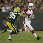 Arizona Cardinals quarterback Drew Stanton scrambles in front of Green Bay Packers' James Nixon during the first half of a preseason NFL football game Friday, Aug. 9, 2013, in Green Bay, Wis. (AP Photo/Tom Lynn)