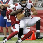 Atlanta Falcons tight end Tony Gonzalez (88) is tackled by Arizona Cardinals cornerback Jerraud Powers during the first half of an NFL football game Sunday, Oct. 27, 2013, in Glendale, Ariz. (AP Photo/Ross D. Franklin)