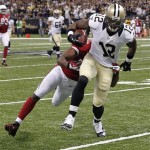 New Orleans Saints wide receiver Marques Colston (12) is tackled by Arizona Cardinals inside linebacker Karlos Dansby after catching a pass in the first half of an NFL football game in New Orleans, Sunday, Sept. 22, 2013. (AP Photo/Bill Haber)