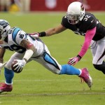 Carolina Panthers wide receiver Steve Smith (89) is knocked down by Arizona Cardinals free safety Tyrann Mathieu (32) during the second half of an NFL football game on Sunday, Oct. 6, 2013, in Glendale, Ariz. (AP Photo/Ross D. Franklin)