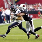 Houston Texans tight end Garrett Graham, left, is tackled by Arizona Cardinals free safety Rashad Johnson (26) during the first half of an NFL football game Sunday, Nov. 10, 2013, in Glendale, Ariz. (AP Photo/Ross D. Franklin)