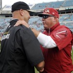 Arizona Cardinals head coach Bruce Arians, right, shakes hands with Jacksonville Jaguars head coach Gus Bradley at the end of an NFL football game on Sunday, Nov. 17, 2013, in Jacksonville, Fla. The Cardinals defeated the Jaguars 27-14. (AP Photo/Stephen Morton)