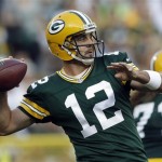Green Bay Packers quarterback Aaron Rodgers drops back to throw during the first half of a preseason NFL football game against the Arizona Cardinals Friday, Aug. 9, 2013, in Green Bay, Wis. (AP Photo/Morry Gash)