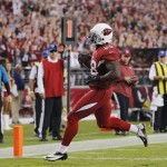Arizona Cardinals running back Rashard Mendenhall scores a touchdown against the Indianapolis Colts during the second half of an NFL football game, Sunday, Nov. 24, 2013, in Glendale, Ariz. (AP Photo/Matt York)