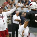 Arizona Cardinals head coach Bruce Arians, left, talks with quarterback Carson Palmer (3) during the Cardinals Red & White scrimmage at NFL football training camp on Saturday, Aug. 3, 2013, in Glendale, Ariz. (AP Photo/Ross D. Franklin)
