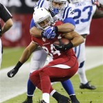 Arizona Cardinals tight end Rob Housler (84) is tackled by Indianapolis Colts strong safety LaRon Landry during the first half of an NFL football game, Sunday, Nov. 24, 2013, in Glendale, Ariz. (AP Photo/Matt York)