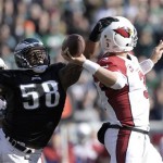 Philadelphia Eagles' Trent Cole (58) knocks the ball loose from Arizona Cardinals' Carson Palmer during the first half of an NFL football game, Sunday, Dec. 1, 2013, in Philadelphia. (AP Photo/Michael Perez)