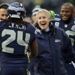 Seattle Seahawks head coach Pete Carroll congratulates running back Marshawn Lynch (24) after Lynch scored on a 20-yard touchdown run during the first quarter of an NFL football game against the Arizona Cardinals in Seattle, Sunday, Dec. 9, 2012. (AP Photo/John Froschauer)	