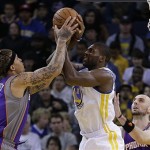Phoenix Suns' Michael Beasley, left, and Golden State Warriors' Festus Ezeli fight for the ball in the first half of an NBA basketball game Saturday, Feb. 2, 2013, in Oakland, Calif. (AP Photo/Ben Margot)
