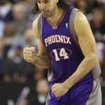 Phoenix Suns forward Luis Scola, of Argentina, pumps his fist after scoring against the Sacramento Kings during the fourth quarter of an NBA basketball game in Sacramento, Calif., Wednesday, Jan. 23, 2013. The Suns won 106-96.(AP Photo/Rich Pedroncelli)