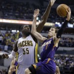 Phoenix Suns guard Goran Dragic, right, shoots under Indiana Pacers center Roy Hibbert in the first half of an NBA basketball game in Indianapolis, Thursday, Jan. 30, 2014. (AP Photo)