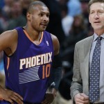 Phoenix Suns guard Leandro Barbosa, left, confers with coach Jeff Hornacek during a timeout against the Denver Nuggets in the first quarter of an NBA basketball game in Denver on Tuesday, Feb. 18, 2014. (AP Photo/David Zalubowski)
