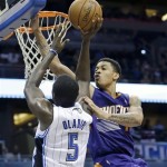 Phoenix Suns' Gerald Green, right, attempts to block a shot by Orlando Magic's Victor Oladipo (5) during the second half of an NBA basketball game in Orlando, Fla., Sunday, Nov. 24, 2013. The Phoenix Suns won 104-96. (AP Photo/John Raoux)