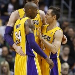 Los Angeles Lakers' Steve Nash, right, Kobe Bryant (24) and Pau Gasol, of Spain, talk during a timeout against the Phoenix Suns during the second half of an NBA basketball game, Wednesday, Jan. 30, 2013, in Phoenix. The Suns won 92-86. (AP Photo/Matt York)