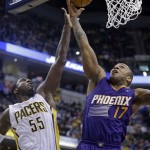 Phoenix Suns forward P.J. Tucker, right, shoots against Indiana Pacers center Roy Hibbert in the first half of an NBA basketball game in Indianapolis, Thursday, Jan. 30, 2014. (AP Photo)