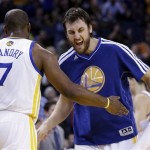 Golden State Warriors' Carl Landry (7) and Andrew Bogut celebrate during a timeout in the second half of an NBA basketball game against the Phoenix Suns on Saturday, Feb. 2, 2013, in Oakland, Calif. (AP Photo/Ben Margot)
