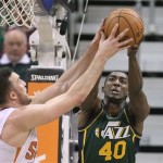  Phoenix Suns' Miles Plumlee, left, and Utah Jazz's Jeremy Evans (40) reach for a rebound in the second quarter during an NBA basketball game Friday, Nov. 29, 2013, in Salt Lake City. (AP Photo/Rick Bowmer)
