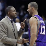 Phoenix Suns coach Lindsey Hunter, left, talks with Kendall Marshall after an NBA basketball game against the Memphis Grizzlie in Memphis, Tenn., Tuesday, Feb. 5, 2013. The Suns defeated the Grizzlies 96-90. (AP Photo/Danny Johnston)