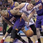 Phoenix Suns' P.J Tucker (17) and Philadelphia 76ers' Spencer Hawes, right, fight for ball control in the second half of an NBA basketball game, Monday, Jan. 27, 2014 in Philadelphia. The Suns won 124-113. (AP Photo/H. Rumph Jr.)