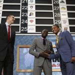 Draft prospects, from left, Alex Len, of Ukraine; Indiana's Victor Oladipo; and Michigan's Trey Burke greet one another on stage before the first round of the NBA basketball draft, Thursday, June 27, 2013, in New York. (AP Photo/Kathy Willens)