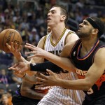 Indiana Pacers forward Tyler Hansbrough, left, battles Phoenix Suns forward Jared Dudley, right, for the loose ball during the first half of an NBA basketball game, Saturday, March 30, 21013, in Phoenix. (AP Photo/Paul Connors)