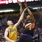 Phoenix Suns' Wesley Johnson (2) shoots over Los Angeles Lakers' Steve Blake (5) in the second half of an NBA basketball game on Monday, March 18, 2013, in Phoenix. The Suns defeated the Lakers 99-76. (AP Photo/Ross D. Franklin)