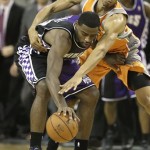 Sacramento Kings guard Tyreke Evans, left, is fouled by Phoenix Suns guard Wesley Johnson during the fourth quarter of an NBA basketball game in Sacramento, Calif., Friday, March 8, 2013. The Kings won 121-112. (AP Photo/Rich Pedroncelli)